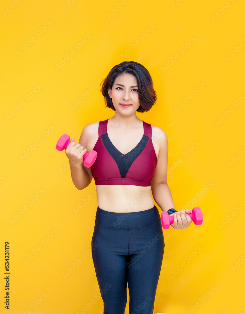 asian woman work out with dumbbel on isolated background asian woman work out with dumbbel on isolated background
