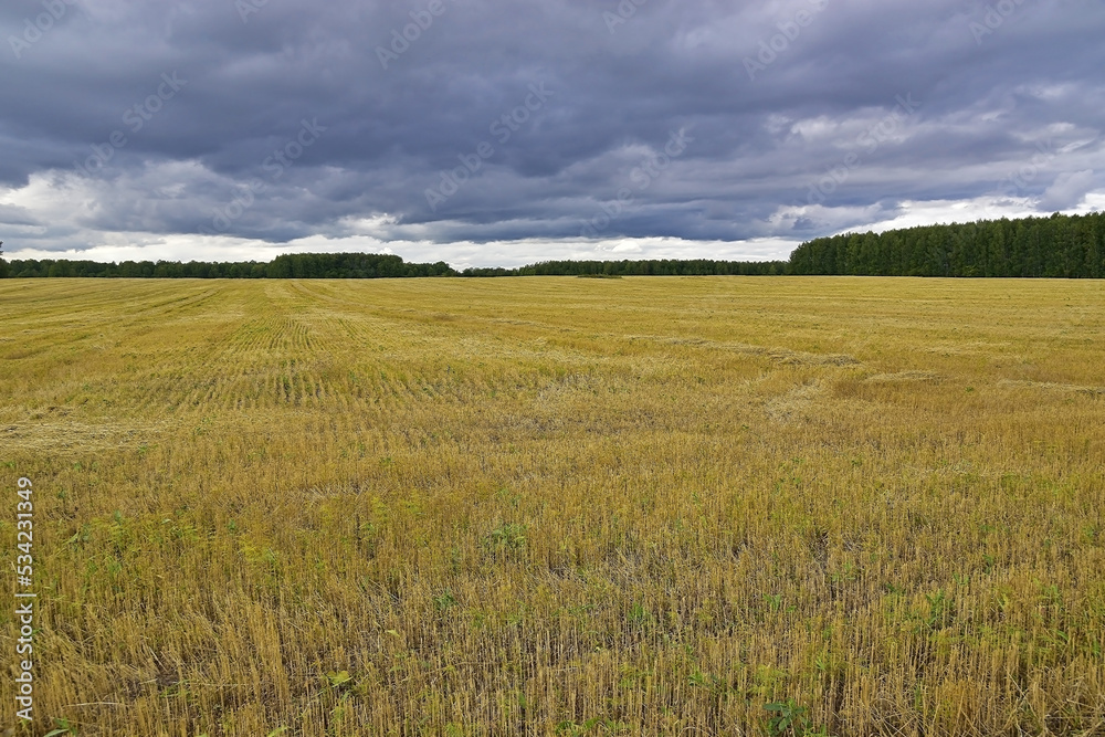 Autumn storm over empty rural fields