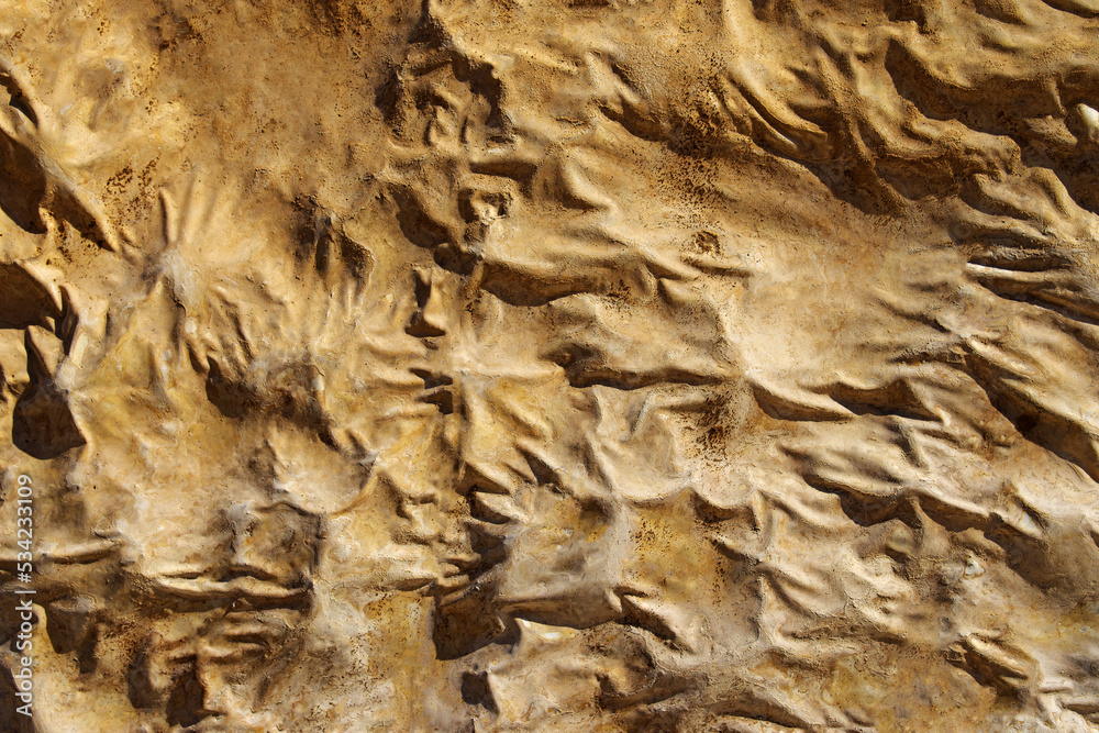 Abstract yellow background from natural stones and clay close-up. Stone background for high resolution wallpaper. Abstract yellow background from natural stones and clay close-up. Stone background for high resolution wallpaper.