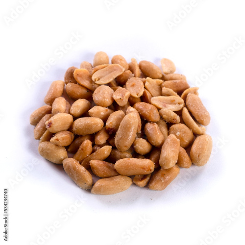 pile of salted peanuts isolated close up on white background 