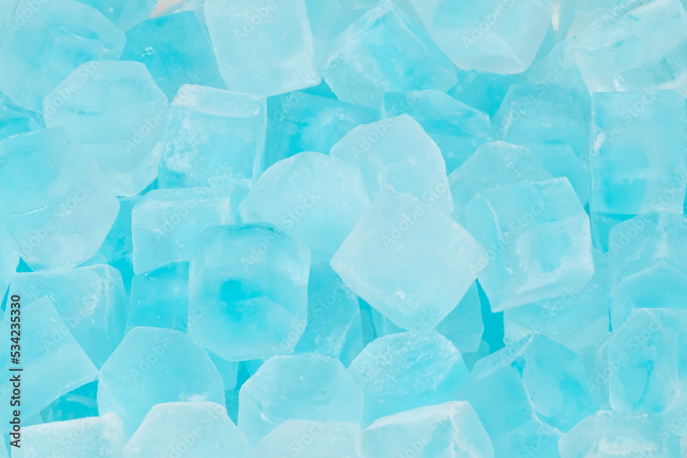 Blue ice cubes background texture. freshness. freezing. pieces of ice close up Blue ice cubes background texture. freshness. freezing. pieces of ice close up