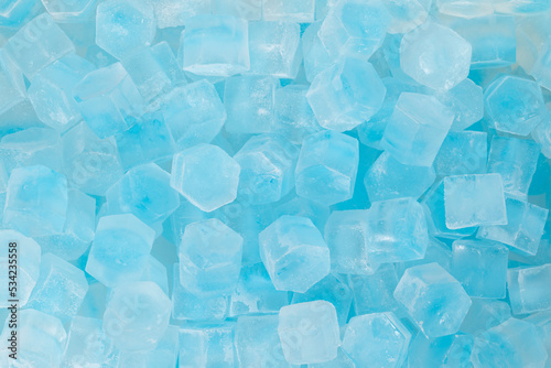 Blue ice cubes background texture. freshness. freezing. pieces of ice close up