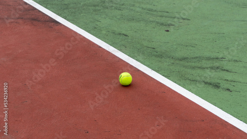 directly above shot of tennis court and yellow tennis ball © fery