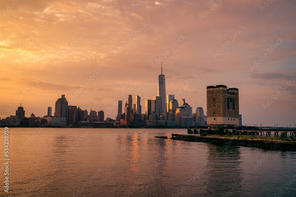 Panoramic New York City skyline at sunrise. Manhattan office buildings/skyscrapers in the morning. Panoramic shot of New York City