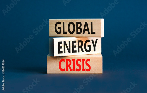 Global energy crisis symbol. Concept words Global energy crisis on wooden blocks. Beautiful grey table grey background. Business and global energy crisis concept. Copy space. © Dzmitry