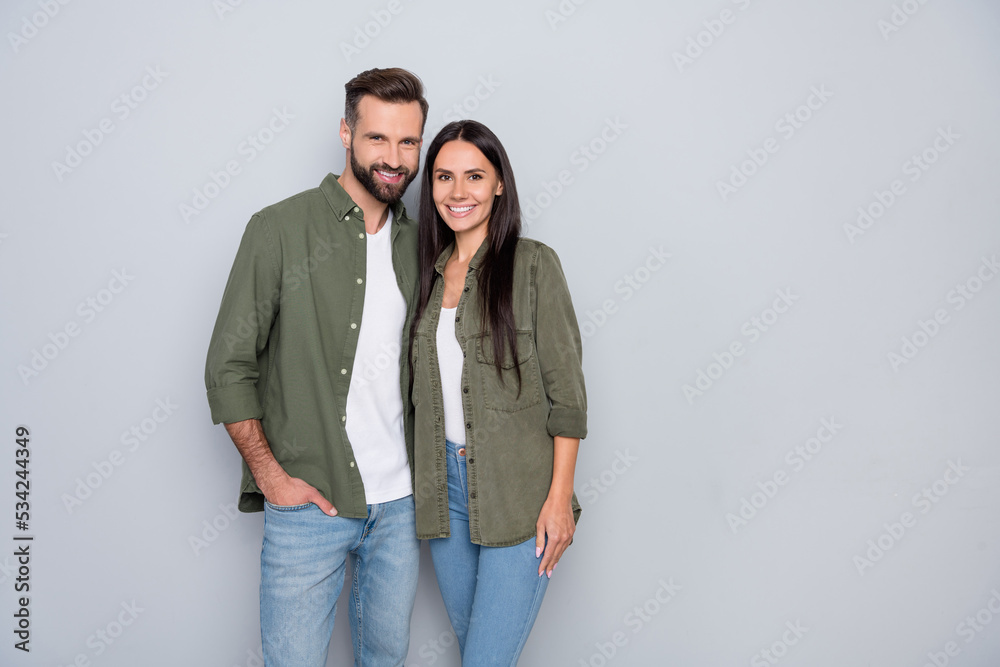 Portrait of attractive cheerful couple spouses hugging romance mood isolated over grey pastel color background Portrait of attractive cheerful couple spouses hugging romance mood isolated over grey pastel color background