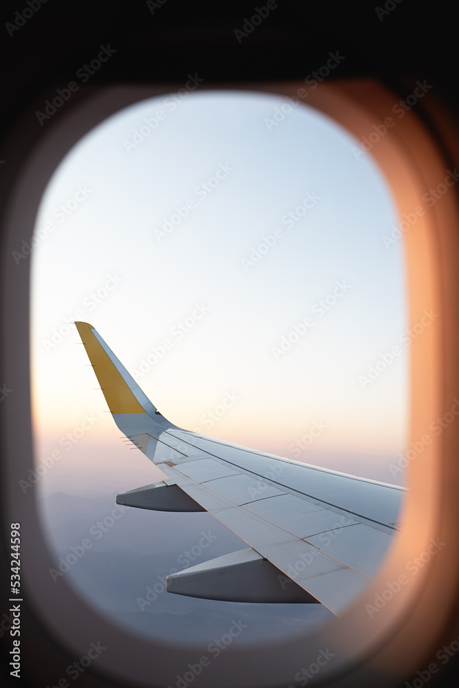 Plane wing in cloudy sky Plane wing in cloudy sky