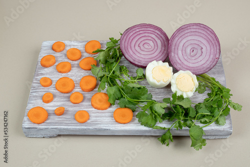 Boiled egg with sliced onion and carrot