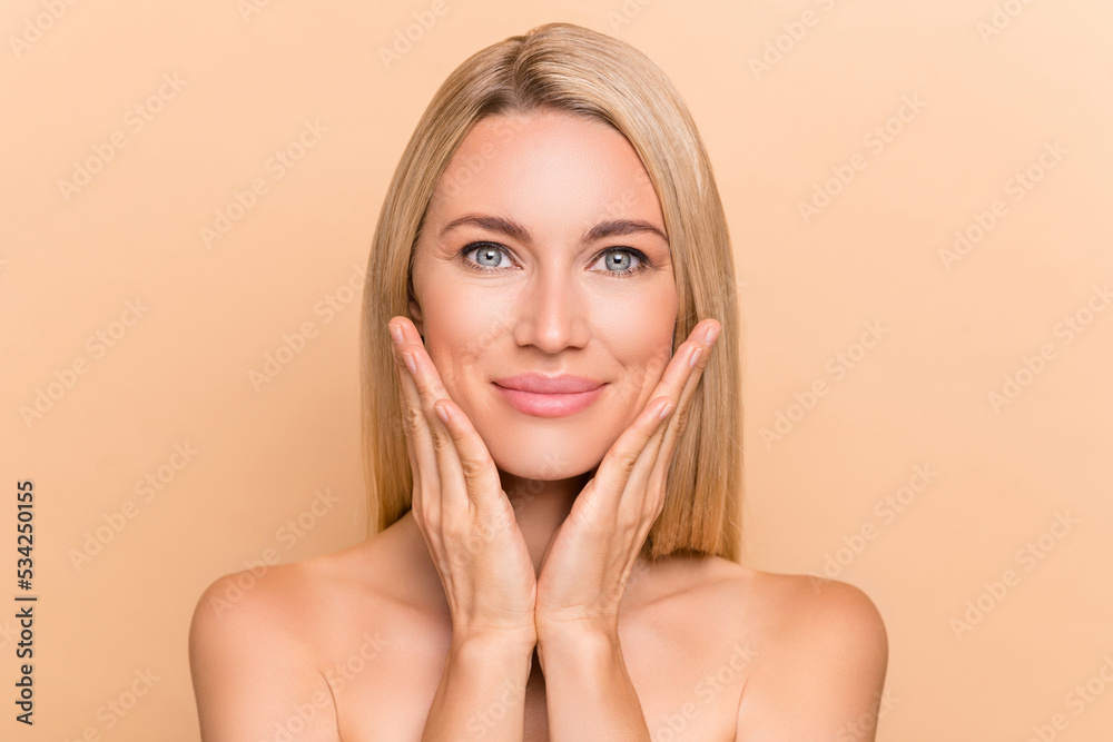 Photo of feminine tender lady touch hands face enjoy pure silky cheeks plastic surgery isolated over beige color background Photo of feminine tender lady touch hands face enjoy pure silky cheeks plastic surgery isolated over beige color background