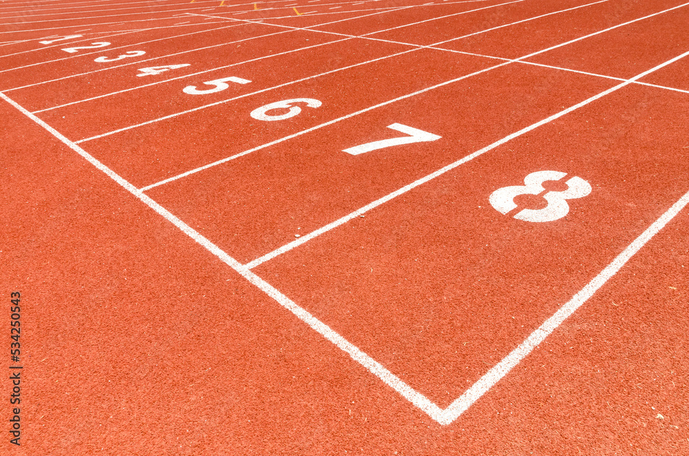 Start or finish position on running line track rubber lanes in the sport stadium.