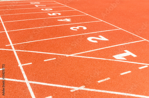 Start or finish position on running line track rubber lanes in the sport stadium. © tkroot