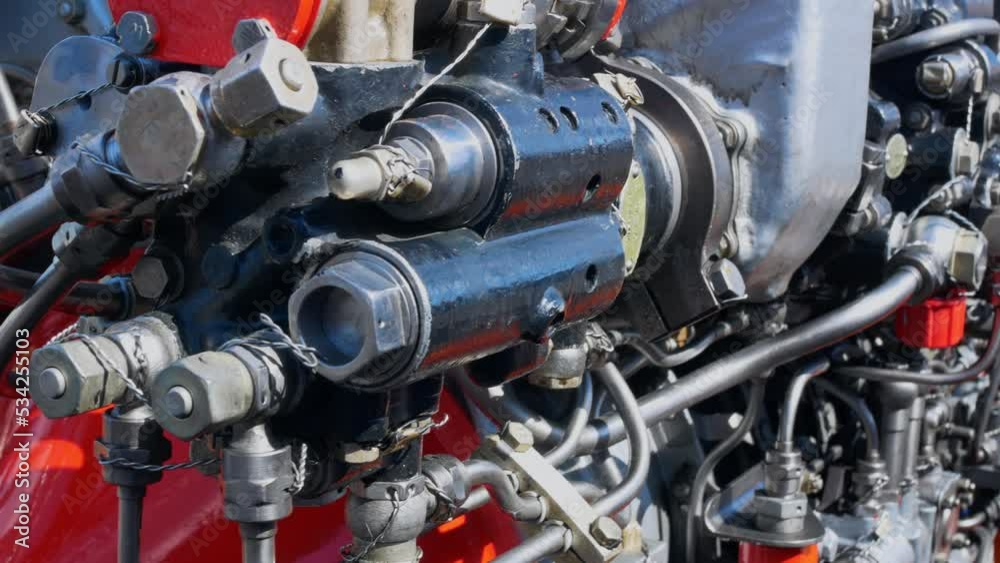 Helicopter aero engine motor mechanism, stainless steel fuel line. Close-up of a jet engine for maintenance and repair. Replacing a helicopter engine to replace a damaged one. Helicopter aero engine motor mechanism, stainless steel fuel line. Close-up of a jet engine for maintenance and repair. Replacing a helicopter engine to replace a damaged one.