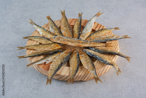 A wooden plate full of delicious fish