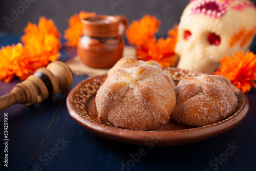 Pan de Muerto. Typical Mexican sweet bread that is consumed in the season of the day of the dead. It is a main element in the altars and offerings in the festivity of the day of the dead. photo