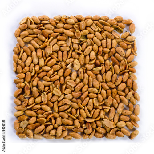 pile of spiced peanuts isolated close up on white background 