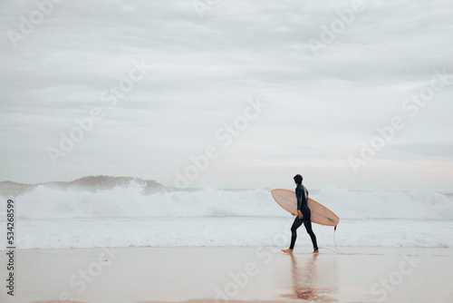 A surfer on Ipanema Beach, Brazil.