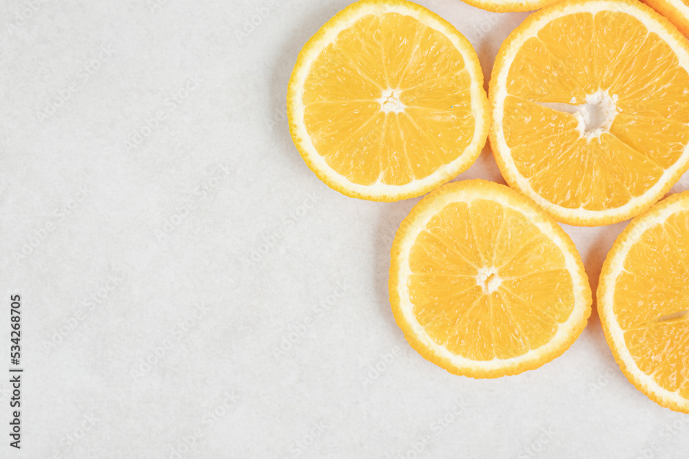 Fresh orange slices on gray background Fresh orange slices on gray background
