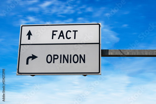 Fact versus opinion road sign.