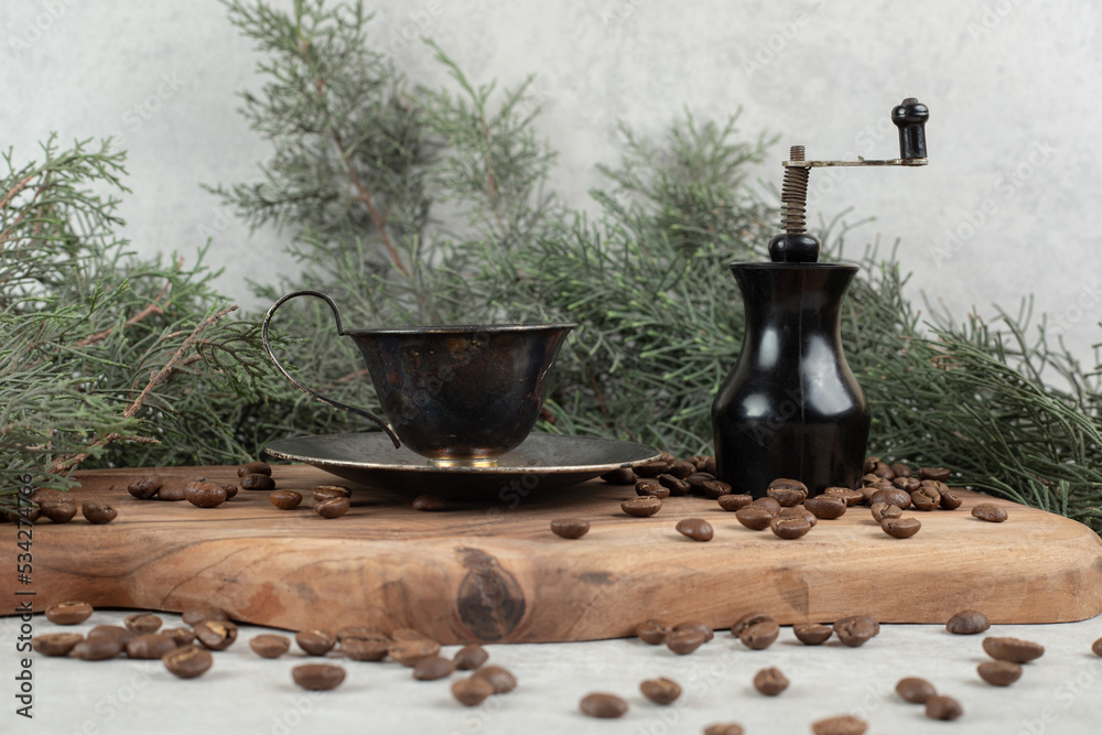 Coffee grinder, beans and aroma coffee on wooden board Coffee grinder, beans and aroma coffee on wooden board