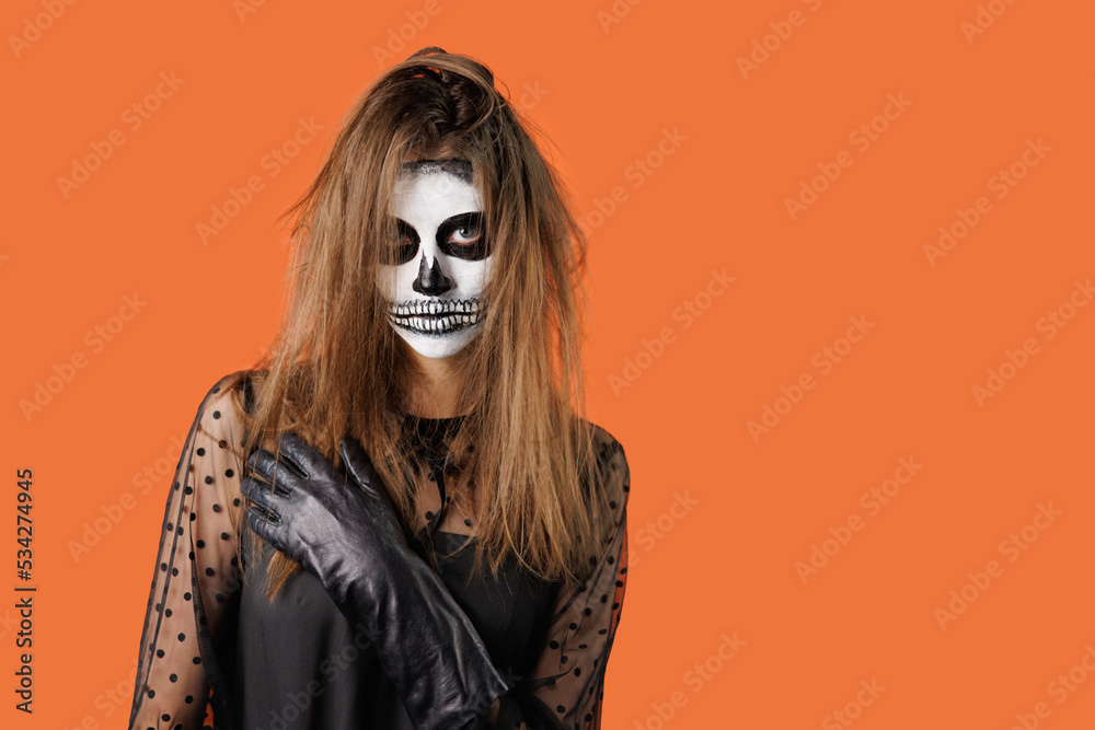 Young brown hair girl with Halloween art posing in studio. Halloween celebration concept.