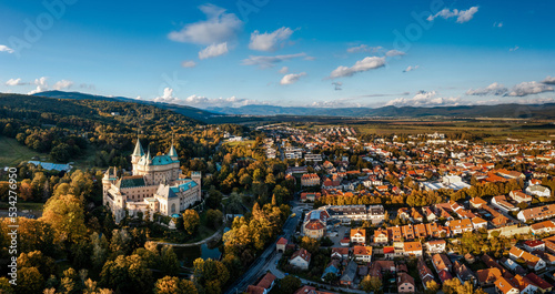 panorama view of Bojnice village and the historic fairy tale castle in Slovakia in autumn colors