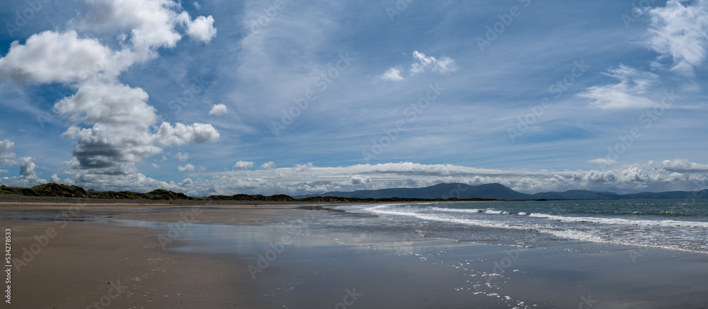 panorama view of the endless golden sand beach in Ballyheigue on the west coast of Ireland