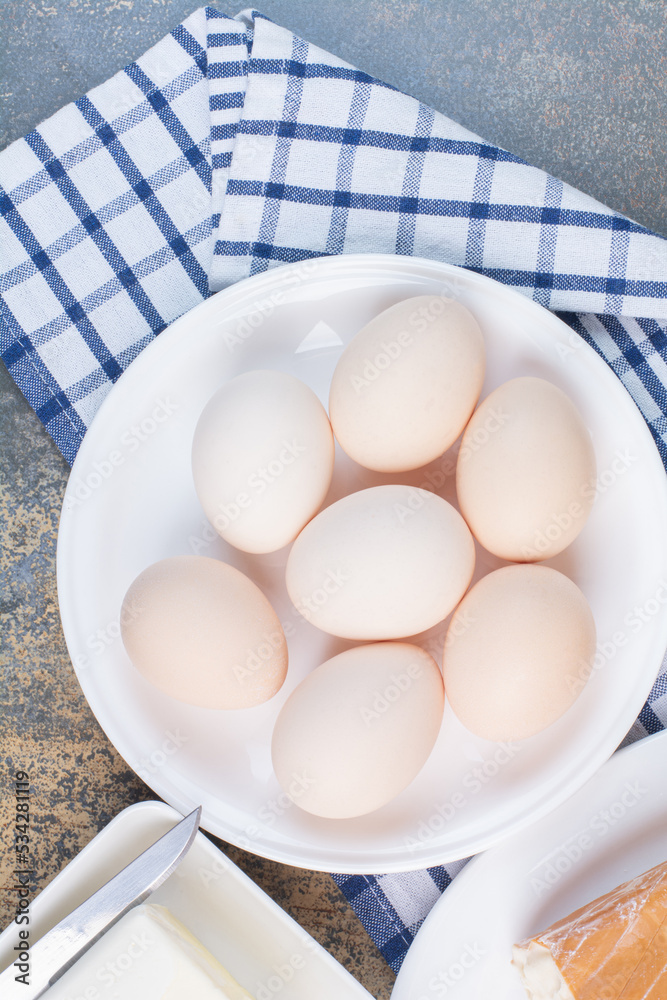 Boiled eggs on white plate with tablecloth Boiled eggs on white plate with tablecloth