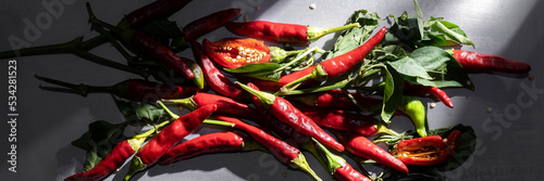 Foto Red hot chili peppers, food ingredients background