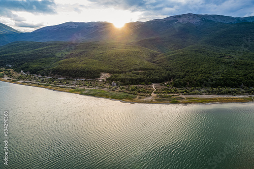 Aerial view of Ohrid-Prespa Transboundary Biosphere Reserve in National Park Galicica in North Macedonia  shore of Prespa lake in sunset