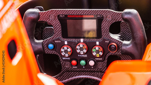Racing car steering wheel.  Detailed view of an open-wheel single-seater formula racing car. © Victor