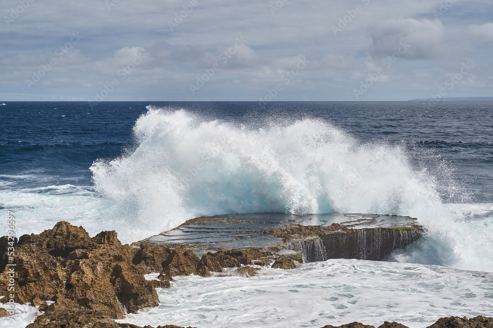 big wave crashing on the rocks 