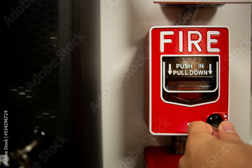 Fire alarm and mock sprinkler system attached to a white wall used for training