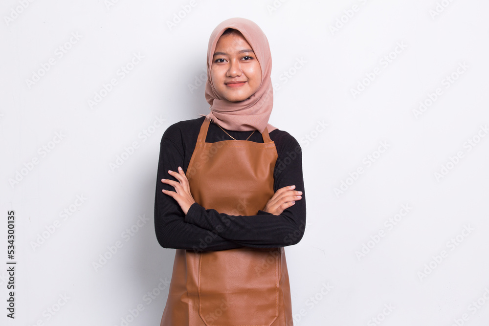 Asian muslim woman barista waitress wearing apron on white background
