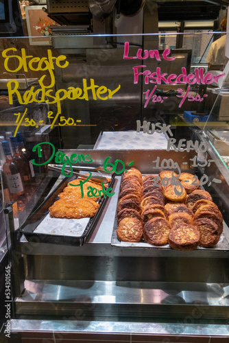 Wall Mural Copenhagen, Denmark A stand sells fish cakes in the Torvehallerne gourmet market