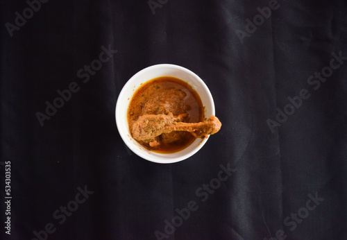 Spicy red chicken curry. Chicken Jhaal masala. Butter chicken Murgh Makhani curry roast hot and spicy gravy dish Dhaba Punjab, India. North Indian non-vegetarian cuisine Garam Masala. tikka photo