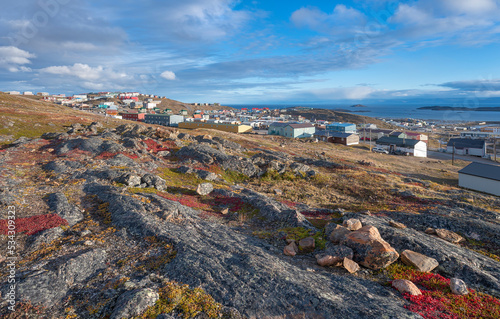 Fototapeta Overview of the city of Iqaluit with the Arctic Ocean harbor in the distance