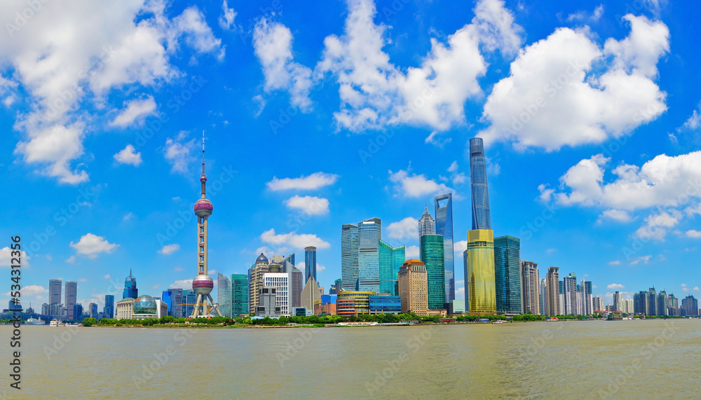 View of the skyline along the riverside on a sunny day in Shanghai, China. View of the skyline along the riverside on a sunny day in Shanghai, China.
