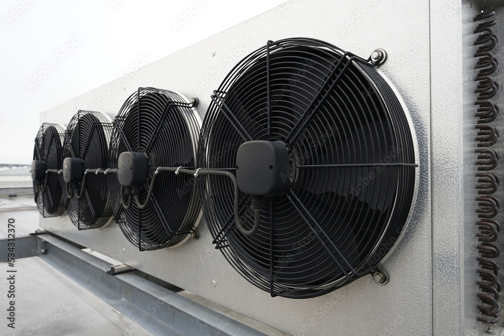 Industrial condenser fans used in air conditioning, refrigeration, heat pump systems, modern eco green energy future concept