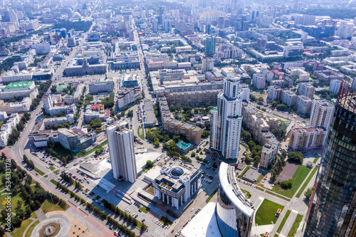 Aerial view of central part of modern city with skyscrapers and residential buildings