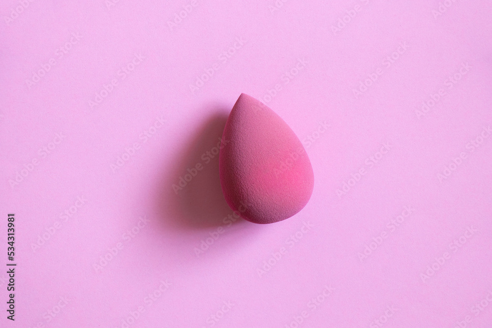 Pink sponge on a pink background, beauty and makeup Pink sponge on a pink background, beauty and makeup