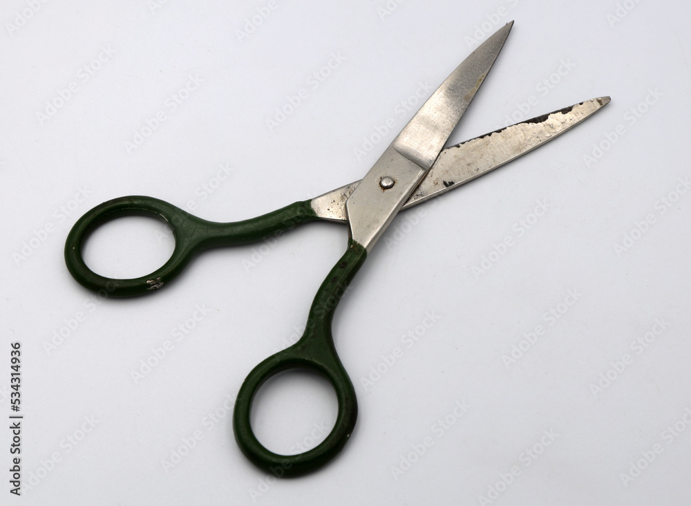 Old scissors on a white background Old scissors on a white background
