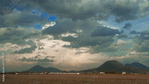Time lapse of the clouds over the euganean hills, padua, Veneto, wine area, wine and grape production, Italy. Cloudy weather, risk of rain. photo