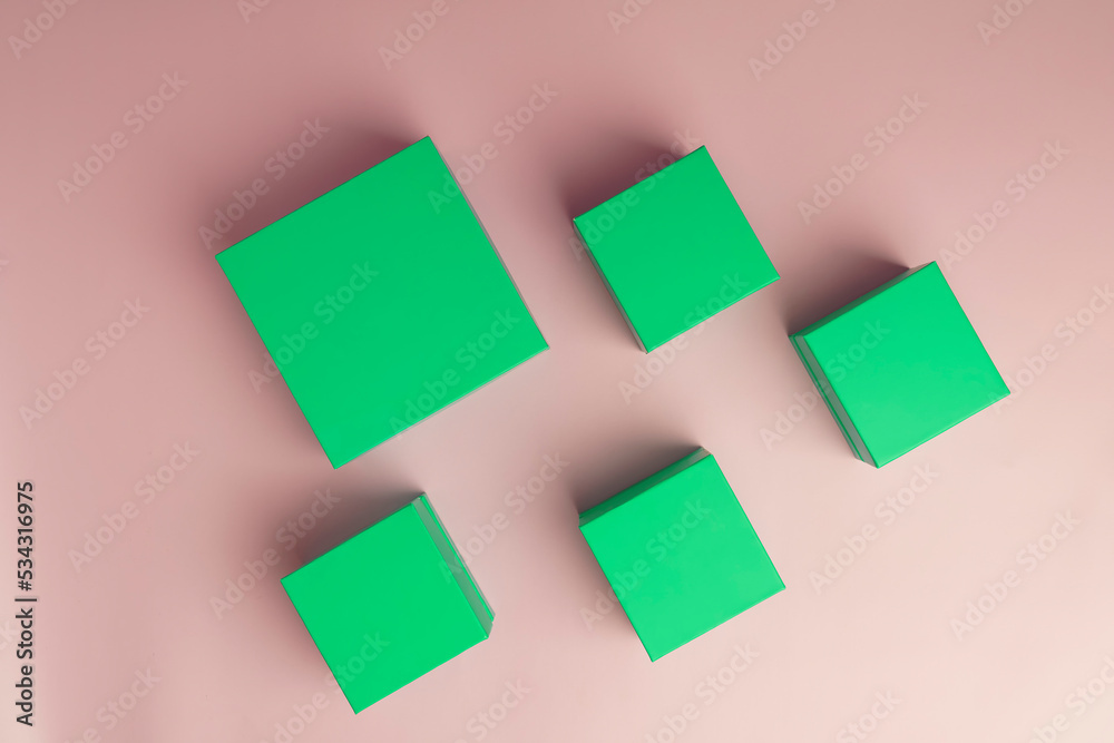 Square green boxes on a pink background Square green boxes on a pink background