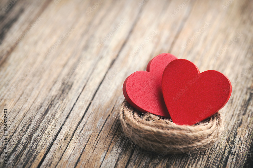 Red heart-shaped on a wooden background. Red heart-shaped on a wooden background.