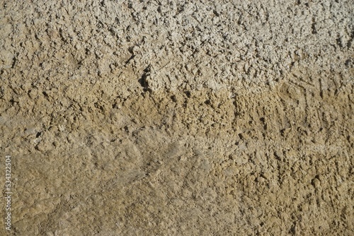 Braun-weißer Sand mit Muster