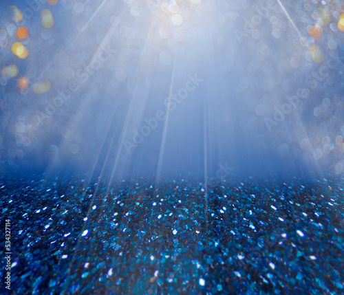 product background blue sequins and sun shining