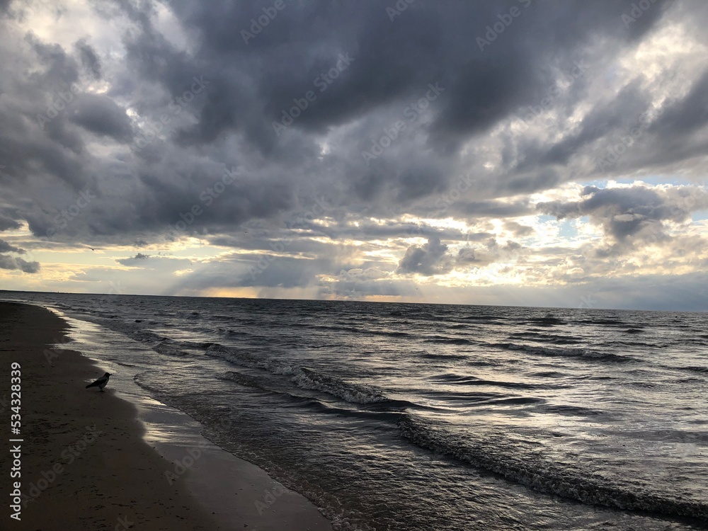 the beginning of a storm on the sea with black clouds the beginning of a storm on the sea with black clouds
