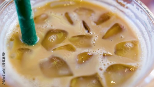 stirring iced coffee 