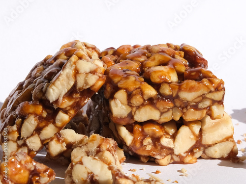 Close up peanut croquant dessert with crumbs. Fistikli krokan in native language. Selective focus. Open space area.