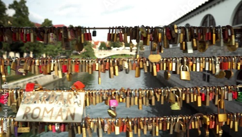 Butcher's Bridge in Ljubljana. Pedestrian bridge over the river Ljubljana in Ljubljana. Bridge of lovers in Ljubljana. Locks of lovers along the railing as a sign of love and fidelity to each other. photo